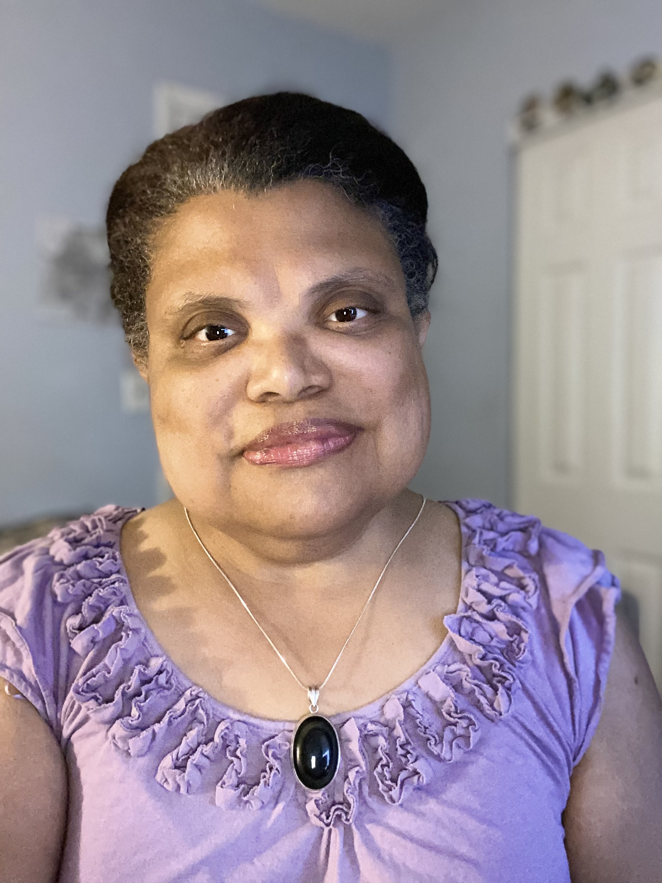 Cherise Pollard, spirit name Ma'hara — founder and practitioner of Pink Light Connection, in warm natural light